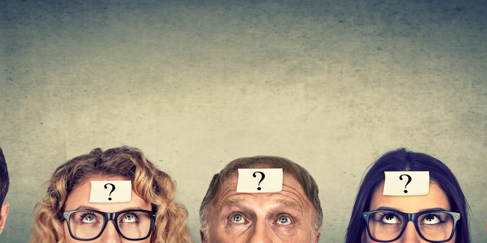 Multiethnic,Group,Of,Thinking,People,With,Question,Mark,Looking,Up